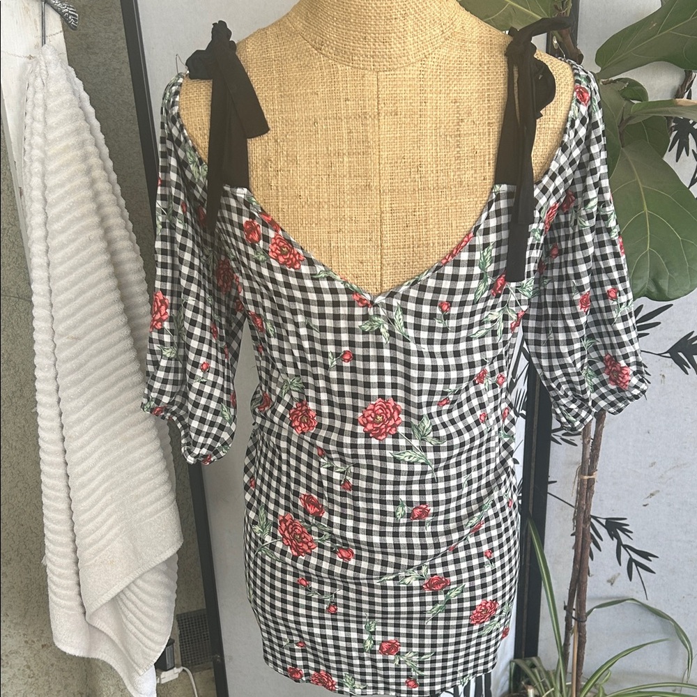 Elegant Black and White Checkered Blouse with Floral Accents